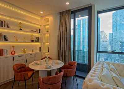 Modern living area with dining table and city view