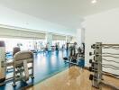 Spacious and well-equipped fitness center with various exercise machines