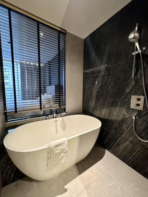 Modern bathroom with standalone bathtub and shower