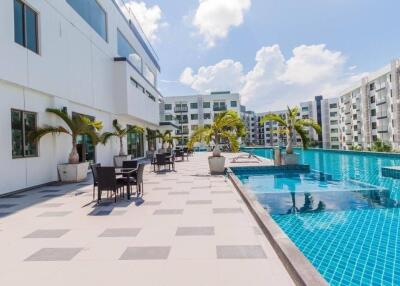 Outdoor pool area with seating