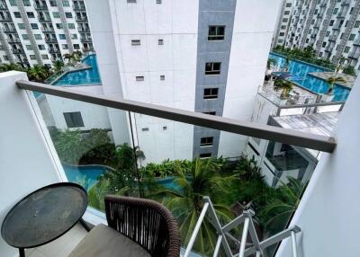 View from balcony over pool and buildings