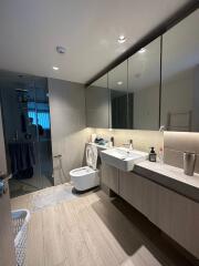 Modern bathroom with large mirror and glass shower