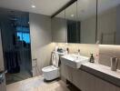 Modern bathroom with large mirror and glass shower