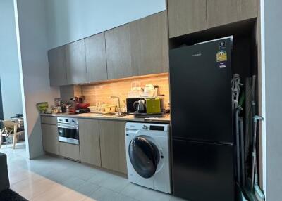 Modern kitchen with appliances and tall cabinets