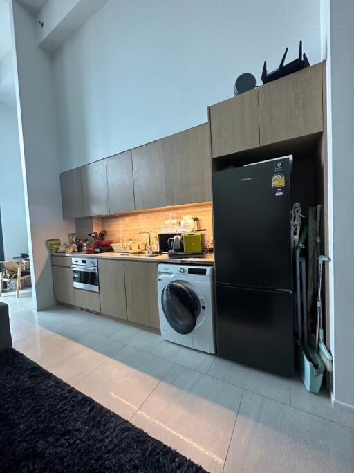 Modern kitchen with appliances and tall cabinets