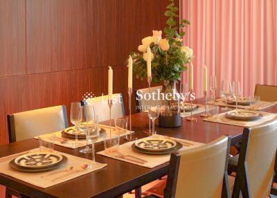 Elegant dining area with table setup and candles