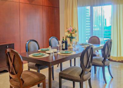 Elegant dining area with a well-set table and natural light