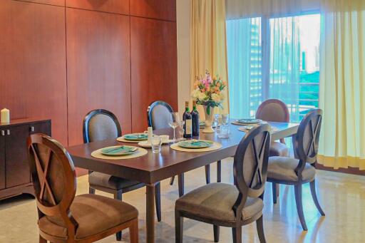 Elegant dining area with a well-set table and natural light