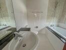 Modern bathroom with sink, bathtub, and tiled walls