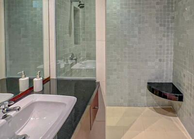 Modern bathroom with large mirror and shower