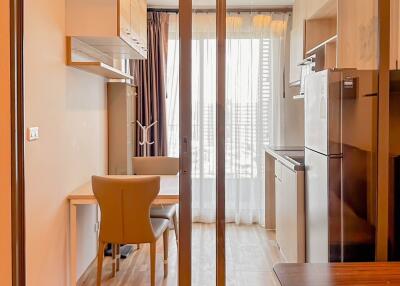 Modern kitchen with dining area and large glass door