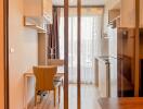 Modern kitchen with dining area and large glass door