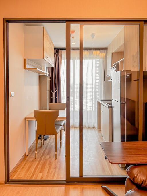 Modern kitchen with dining area and large glass door