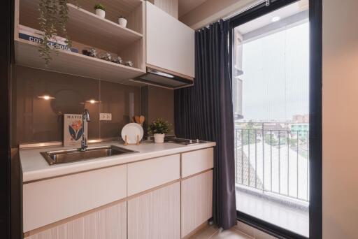 Modern kitchen with balcony access