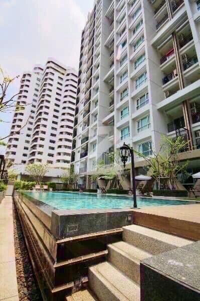 High-rise apartment buildings with a swimming pool