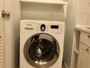 Compact laundry area with Samsung washing machine