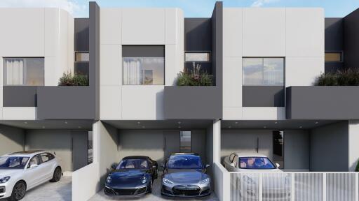 Modern residential building with garages and parked cars