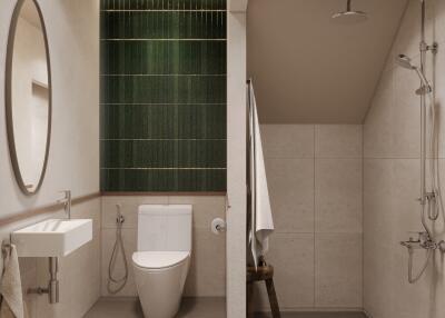 Modern bathroom with green tiled accent wall and walk-in shower