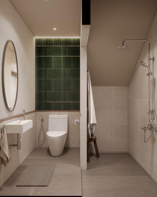 Modern bathroom with green tiled accent wall and walk-in shower