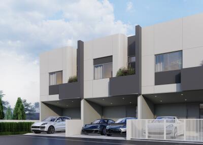 Modern residential building exterior with multiple garages and cars