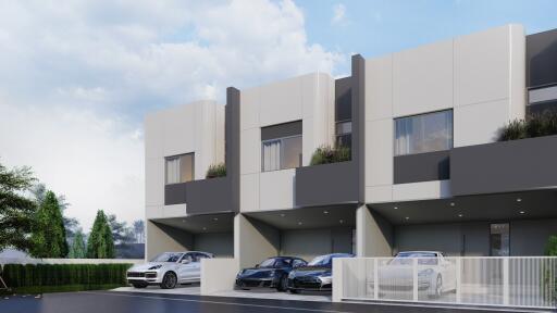 Modern residential building exterior with multiple garages and cars