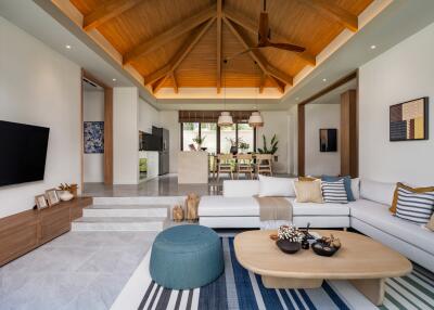 Spacious and modern living room with wooden ceiling and contemporary decor