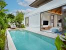 Outdoor pool area with adjacent modern living space