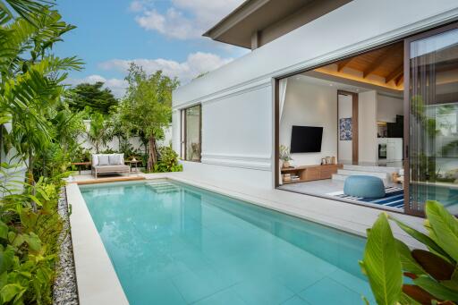 Outdoor pool area with adjacent modern living space