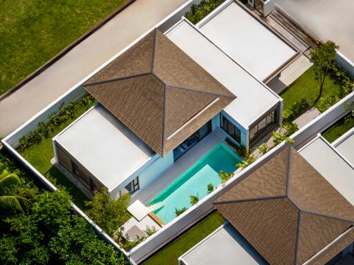 Aerial view of a modern house with a pool