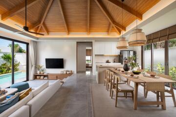 Spacious living room with wooden ceiling, open kitchen, and dining area