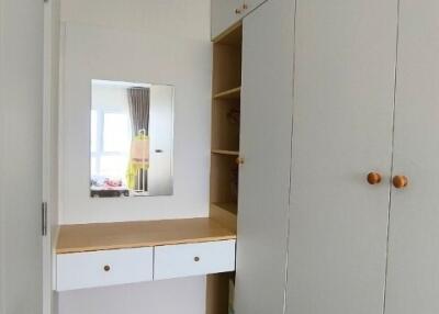 Bedroom with built-in wardrobe and vanity area