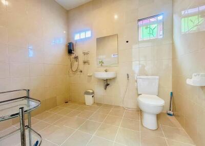 Spacious and well-lit bathroom with modern amenities