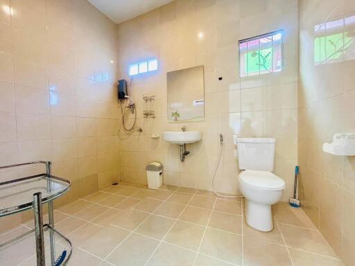 Spacious and well-lit bathroom with modern amenities