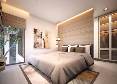 Modern bedroom with a large bed, natural light, and built-in wardrobes