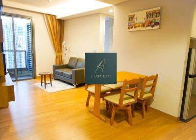 Modern living and dining area with city view