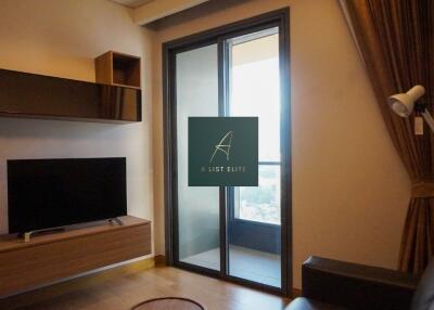 Modern living room with flat-screen TV and balcony