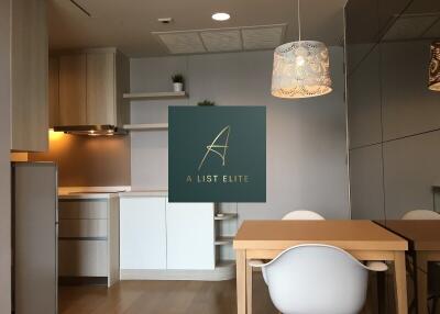 Modern kitchen and dining area with light fixtures and built-in cabinets