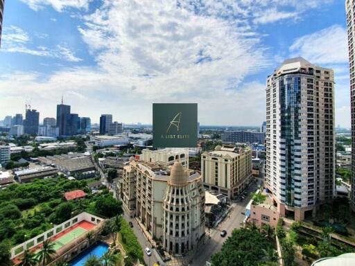 Aerial view of city skyline with modern buildings and greenery