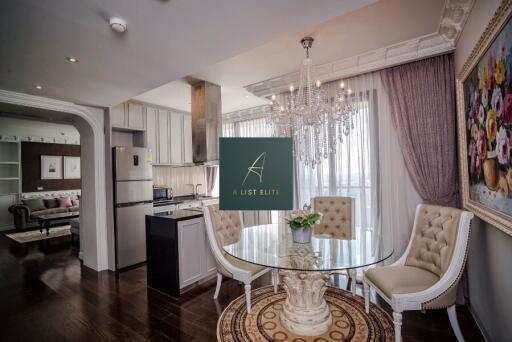 Elegant dining area with glass table and chandelier