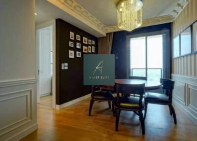 Stylish dining room with elegant chandelier and wall decor