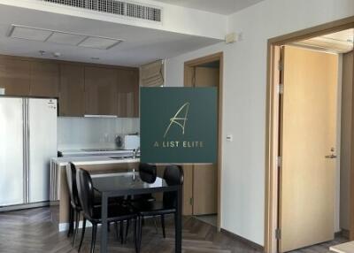 Dining area in an open floor plan with kitchen and living space