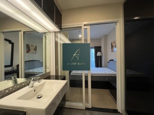 Bathroom with adjacent bedroom view