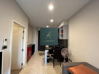 Modern kitchen and dining area with hallway view