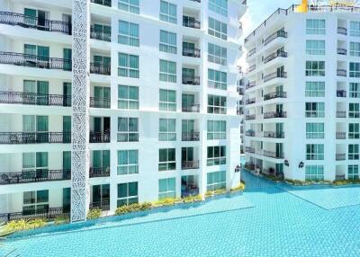 Exterior view of modern white residential buildings with pool