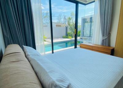 Modern bedroom with pool view