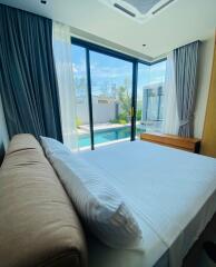 Modern bedroom with pool view