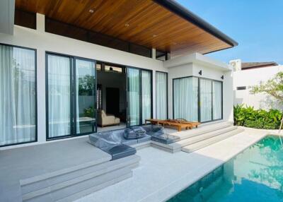 Modern patio with pool and lounging area