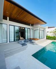 Modern patio with pool and lounging area