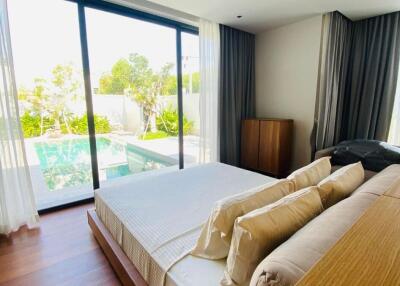 Spacious bedroom with a view of the pool