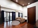 Bedroom with wooden flooring and modern furnishings